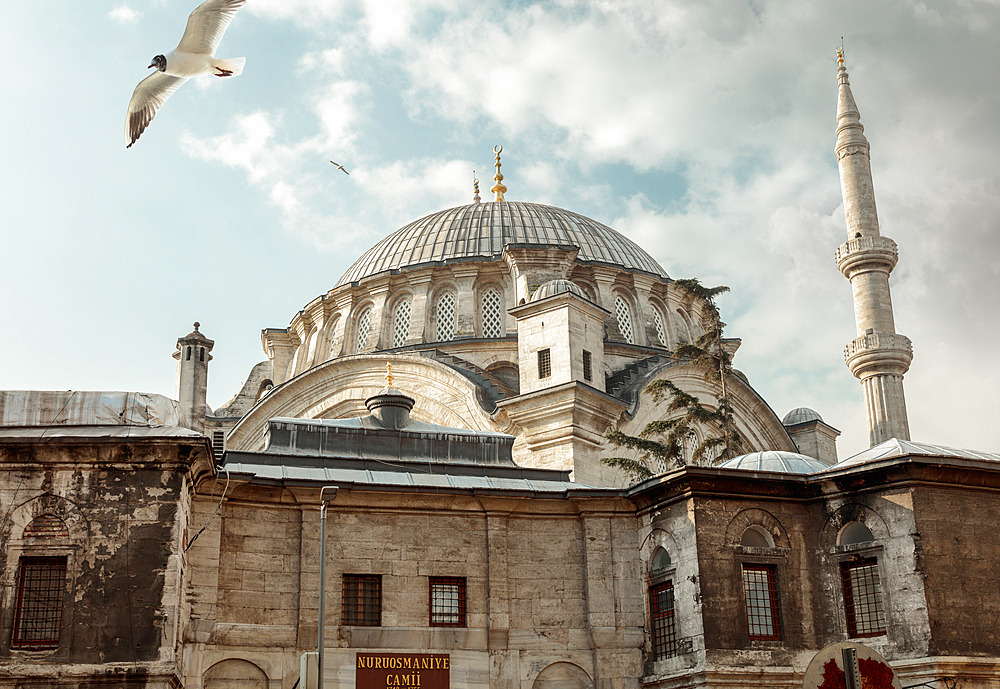 Nuruosmaniye Mosque illuminated with light in cloudy weather, Istanbul, Turkey, Europe