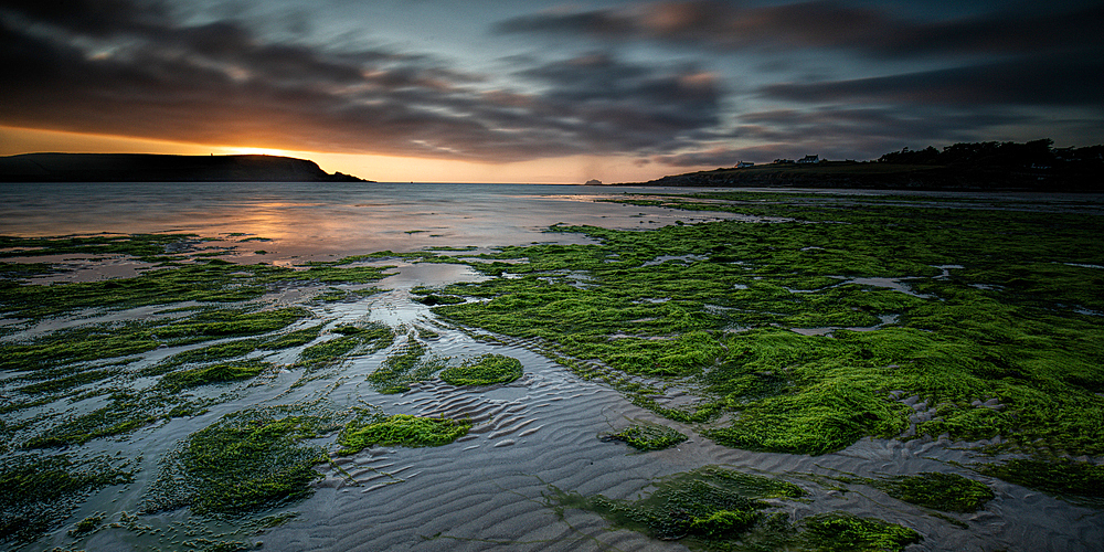 The sun setting at Daymer Bay, Cornwall, England, United Kingdom, Europe