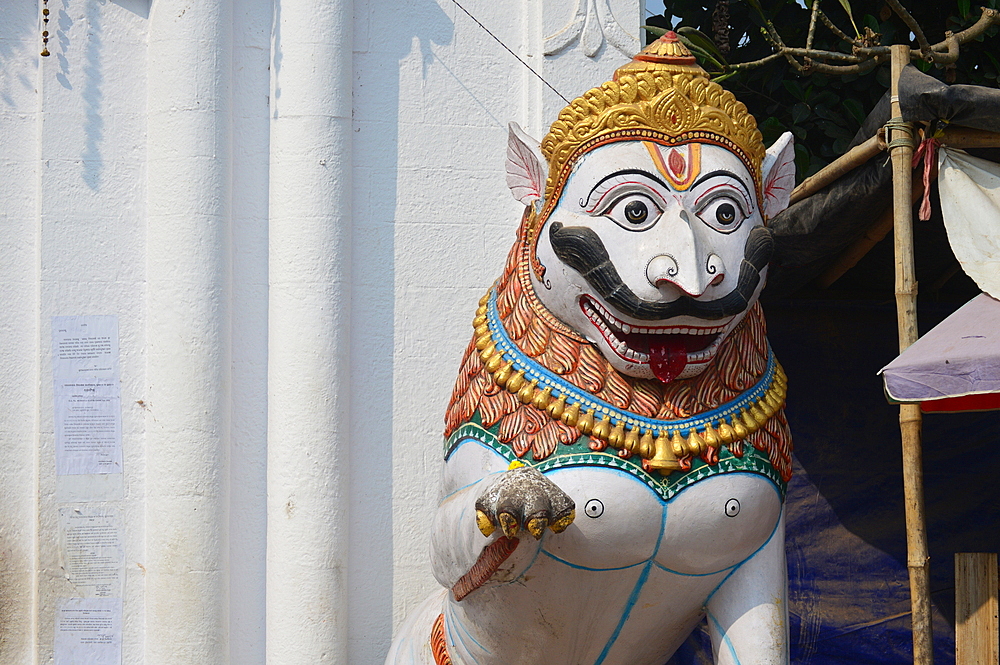 Ferocious lion figures guarding Alarnath Hindu temple at Bhramagiri near Puri Odisha India.