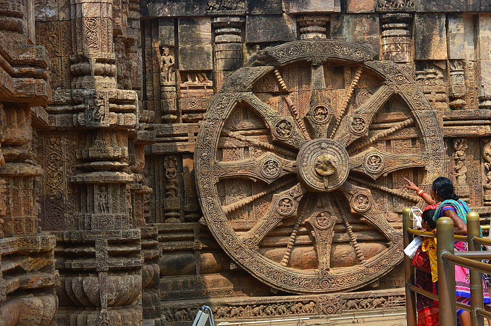 Konark 13th-century Sun Temple (Surya Deula) designed to represent chariot of Hindu Sun God with 12 huge carved stone wheels and 7 stone horses around its base UNESCO World heritage site.Images of stone chariot wheels.