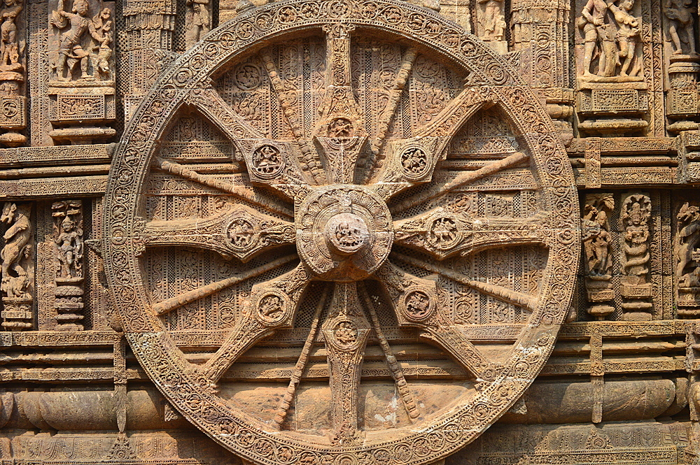 Konark 13th-century Sun Temple (Surya Deula) designed to represent chariot of Hindu Sun God with 12 huge carved stone wheels and 7 stone horses around its base UNESCO World heritage site.Images of stone chariot wheels.