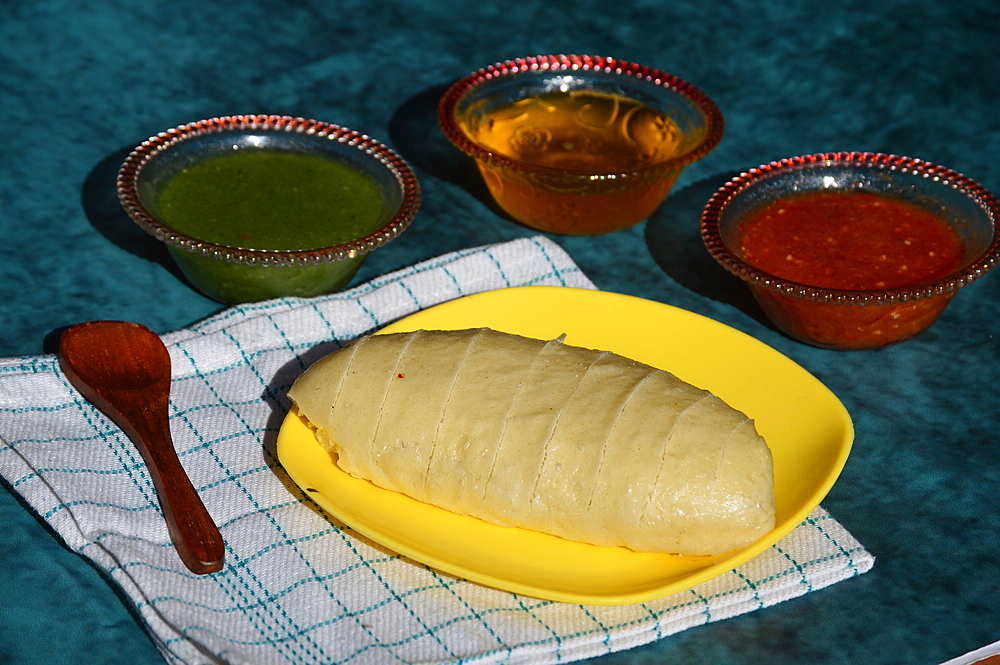 Siddu, a special traditional dish of Himachal Pradesh, a steamed wheat flour bread stuffed with split black lentils and dry fruits, served with desi ghee, tomato and green mint chutney, Himachal Pradesh, India, Asia