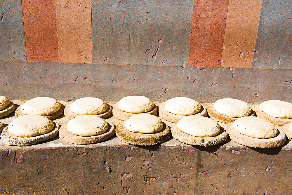 Bread dough put in the sun on a bench in a street of Daraw, Egypt, North Africa, Africa