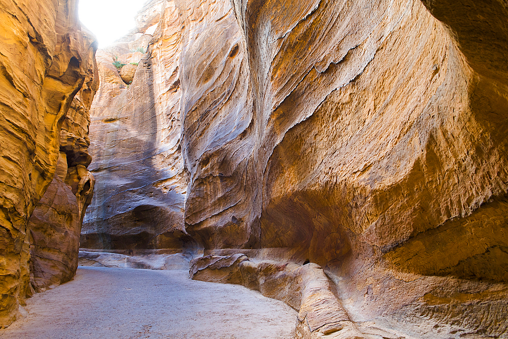 Aqueduct dug into the walls of the Siq, narrow gorge leading to the historic and archaeological Nabataean city of Petra, UNESCO World Heritage Site, Jordan, Middle East