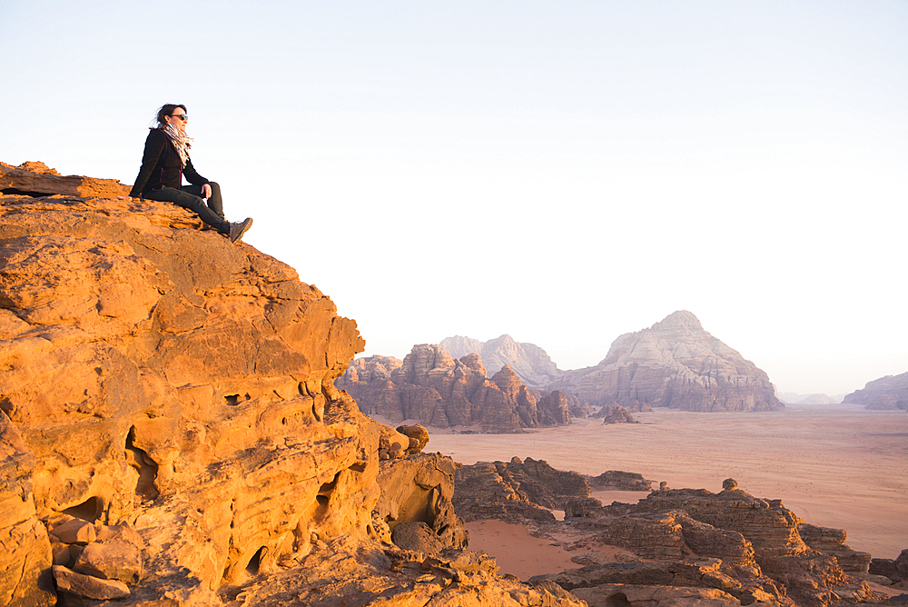 Woman enjoying sunset in Wadi Rum desert, UNESCO World Heritage Site, Jordan, Middle East