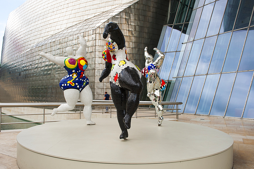 temporary exhibition of 'Nanas' by the French artist Niki de Saint Phalle (1930-2002) at the Guggenheim Museum designed by architect Frank Gehry, Bilbao, province of Biscay, Basque Country, Spain,Europe