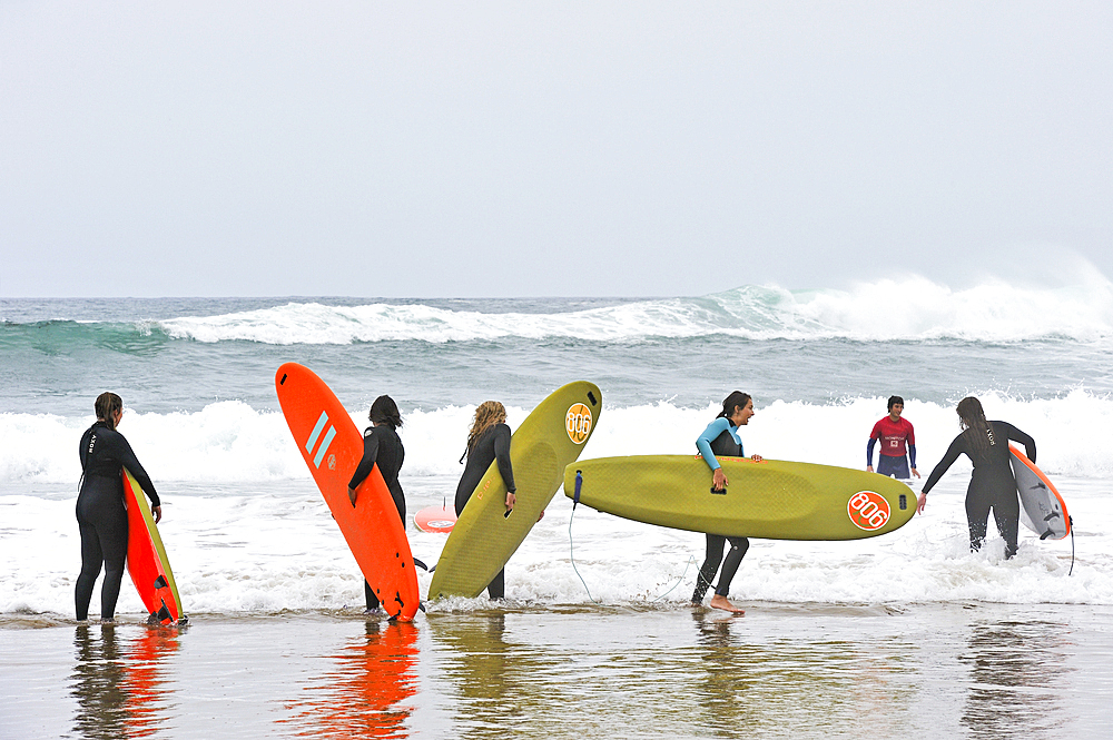 surf class on Zurriola beach, district of Gros, San Sebastian, Bay of Biscay, province of Gipuzkoa, Basque Country, Spain,Europe