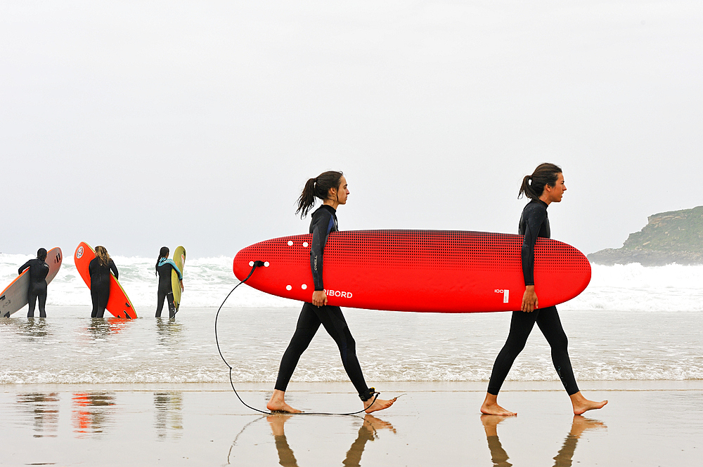 surf class on Zurriola beach, district of Gros, San Sebastian, Bay of Biscay, province of Gipuzkoa, Basque Country, Spain,Europe