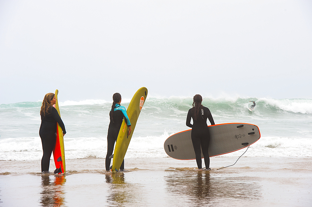 surf class on Zurriola beach, district of Gros, San Sebastian, Bay of Biscay, province of Gipuzkoa, Basque Country, Spain,Europe