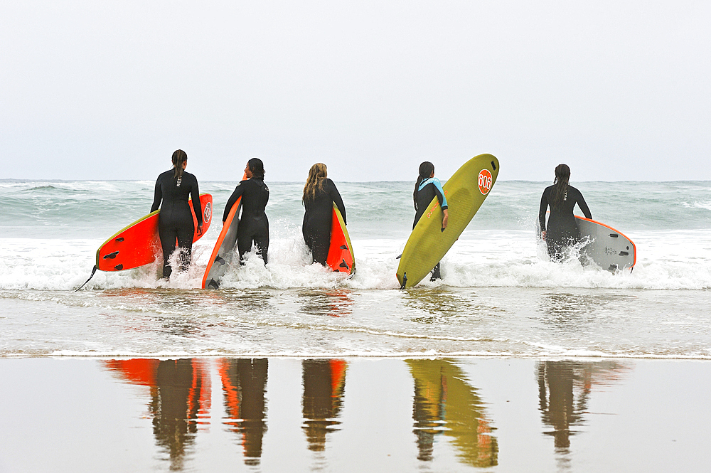 surf class on Zurriola beach, district of Gros, San Sebastian, Bay of Biscay, province of Gipuzkoa, Basque Country, Spain,Europe