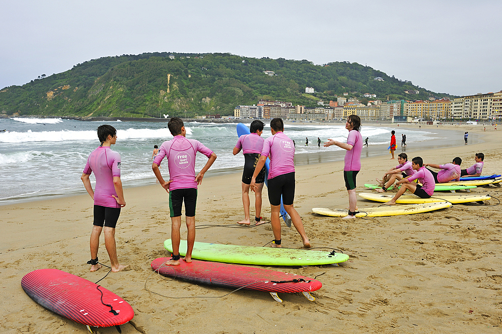 surf class on Zurriola beach, district of Gros, San Sebastian, Bay of Biscay, province of Gipuzkoa, Basque Country, Spain,Europe