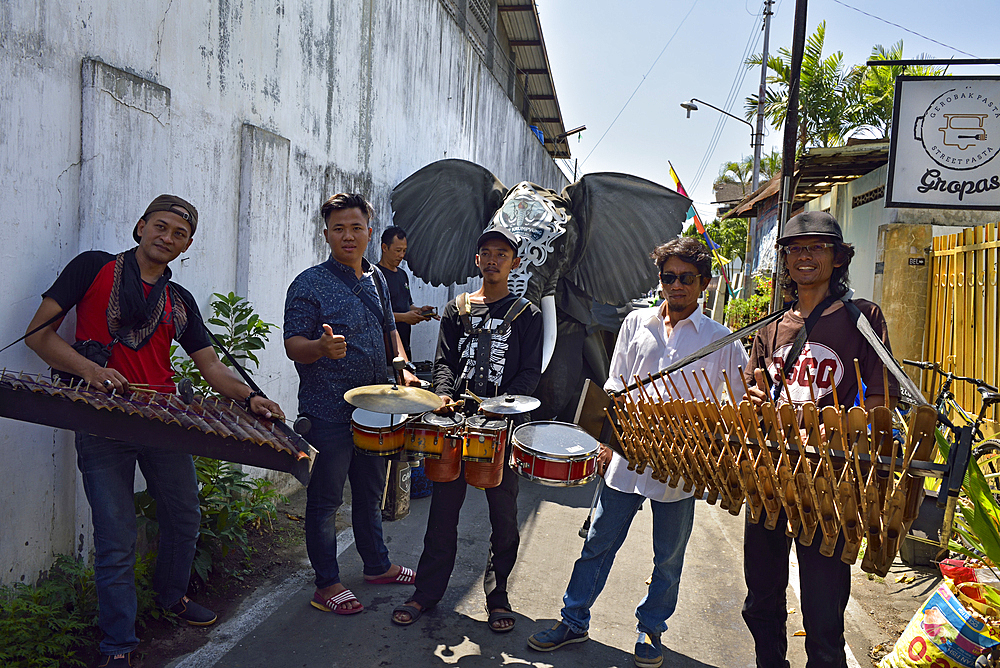 percussion players at a welcoming performance of Gajah Krumpyung (fake elephant and traditional music instrument), Sondakan district, Solo (Surakarta), Java island, Indonesia, Southeast Asia