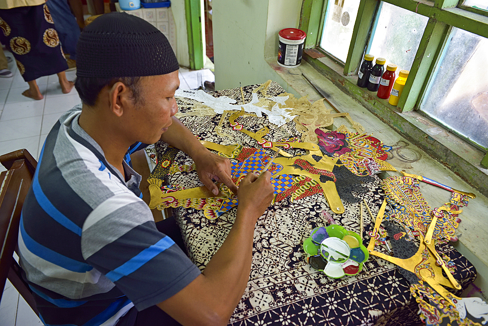 Workshop of puppets for shadow play (wayang kulit), Bima Art Shadow Puppet Maker, Sondakan district, Solo (Surakarta), Java island, Indonesia, Southeast Asia, Asia