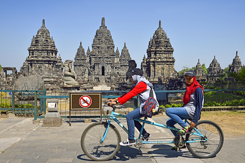 tourist bike ride, Sewu Temple Compound, eighth century Buddhist temple located at the north of Prambanan Temple Compounds, region of Yogyakarta, Java island, Indonesia, Southeast Asia