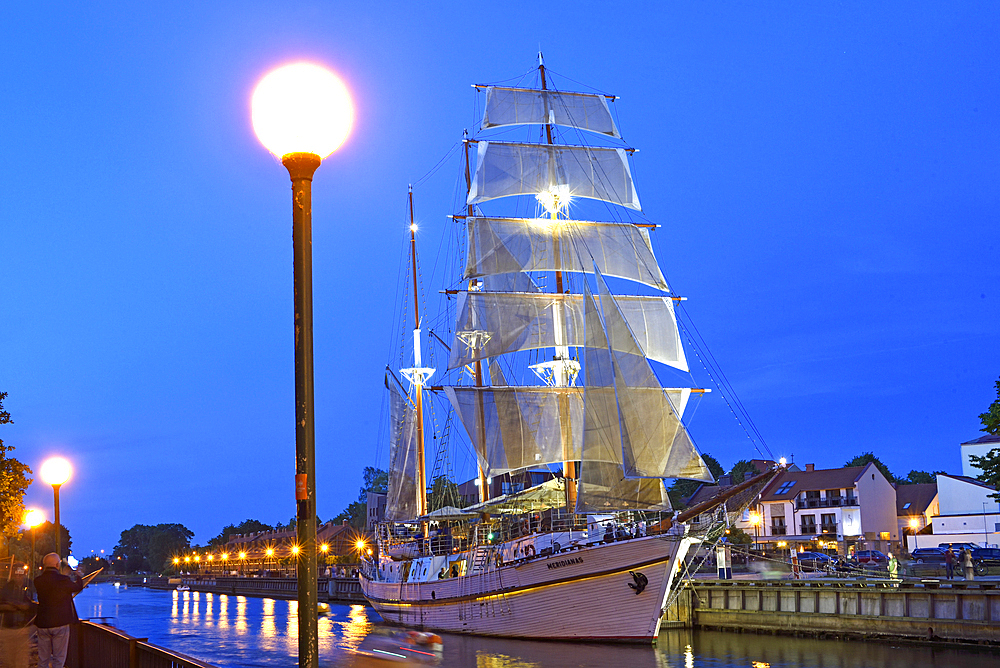 Barquentine Meridianas, now converted for catering purposes, moored by the embankment of the Dane river, Klaipeda, port city on the Baltic Sea, Lithuania, Europe