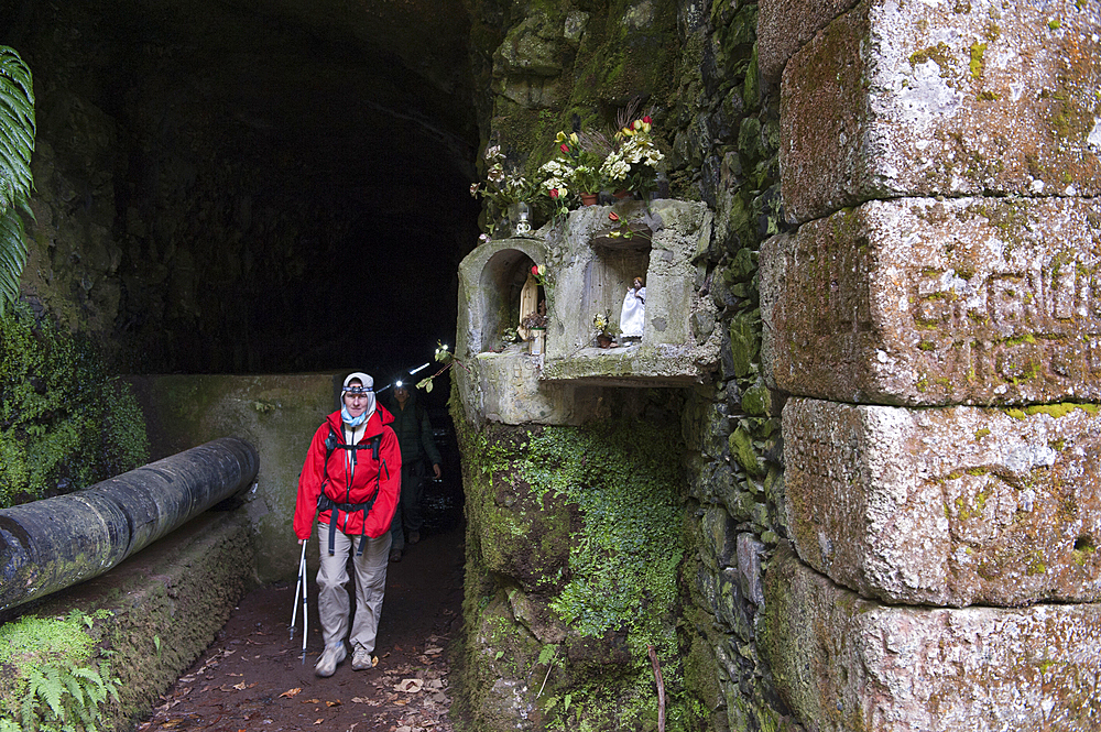 Shrine at entrance to levada tunnel (aqueduct) around Rabacal, Paul da Serra plateau, Madeira island, Atlantic Ocean, Portugal