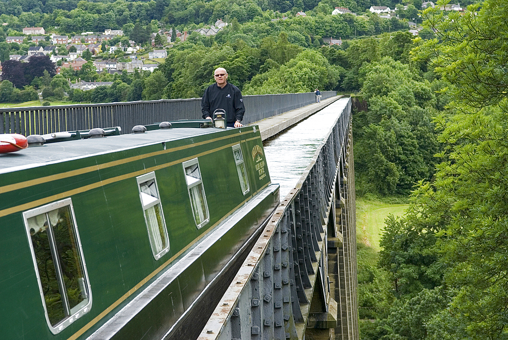 Narrow boat on Pontcysyllte Aqueduct, UNESCO, Llangollen Canal over valley of the River Dee, Wales, United Kingdom