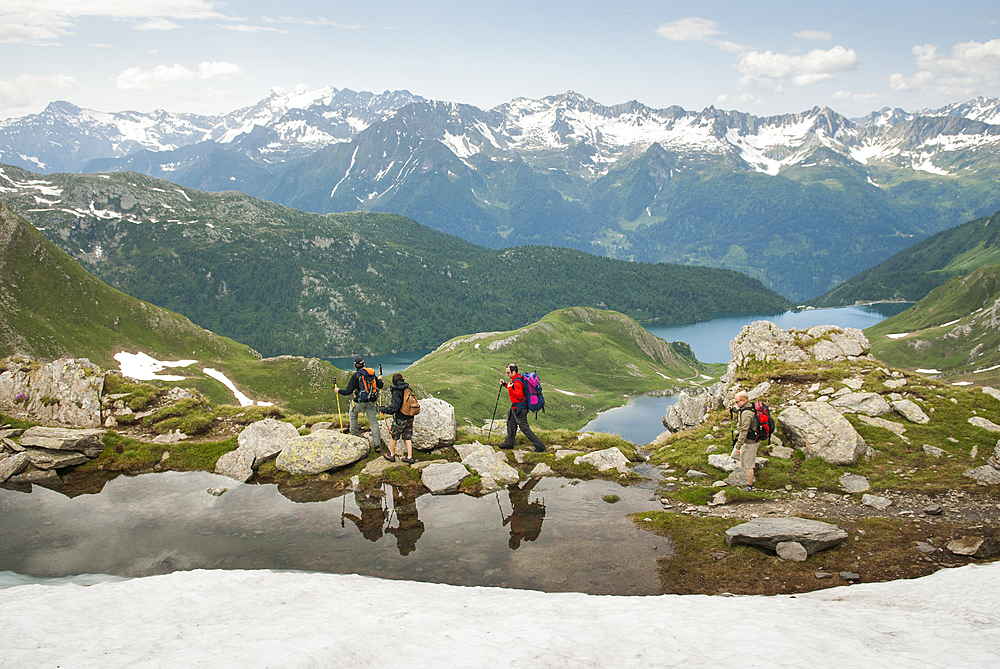 Trekkers above Tom et Ritom lakes, Val Piora, Canton Ticino, Switzerland