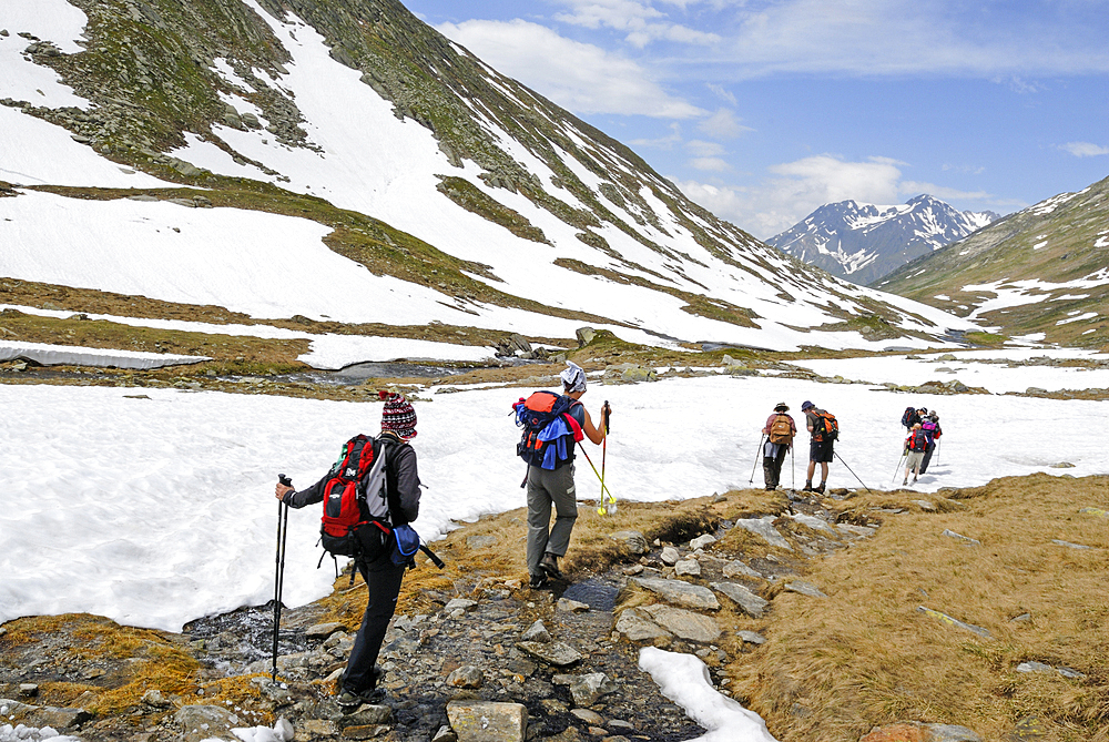 Trekkers along the Reno di Medel river, Val Piora, Canton Ticino, Switzerland