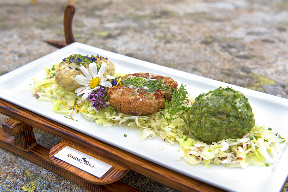 Meal, knodel (canederli), Knuttenalm mountain restaurant (Malga Knutten) near Ahrntal (Valle Aurina), South Tyrol (Alto Adige), Italy