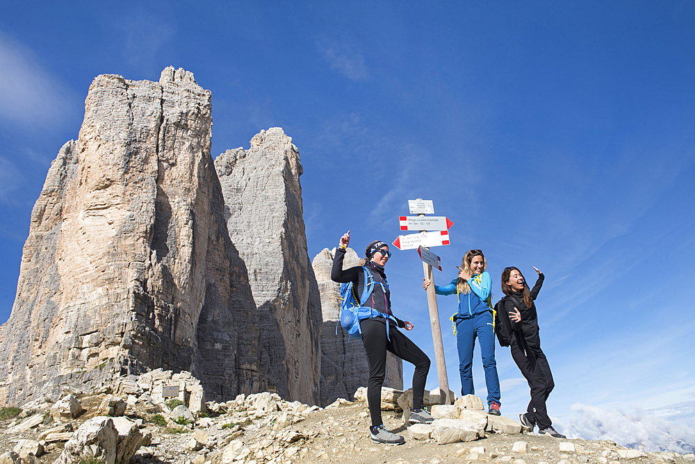 three hikers taking selfies at the foot of the Tre Cime di Lavaredo (Three Peaks of Lavaredo), Three Peaks nature park, Trentino-Alto Adige, Sudtyrol, South Tyrol, Italy, South-central Europe