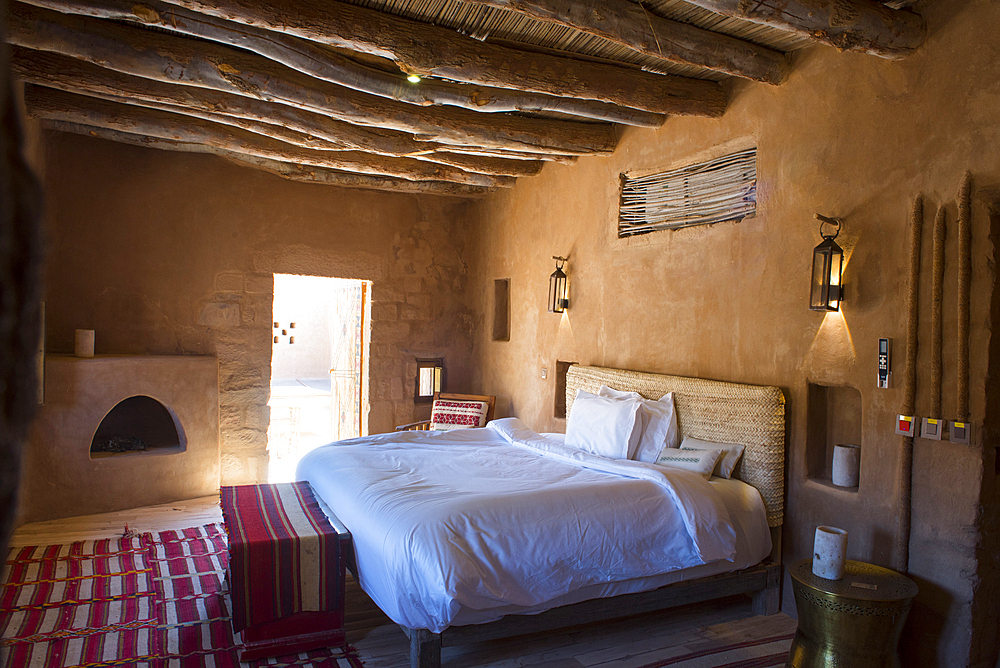 Room of an house (Dar) of Dar Tantora The House Hotel, a renovated original mudbrick village in the oasis of AlUla, Medina Province, Saudi Arabia, Middle East