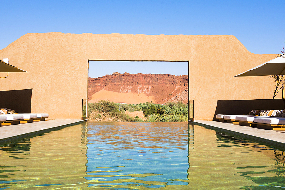 Swimming pool of Dar Tantora The House Hotel, a renovated original mudbrick village in the oasis of AlUla, Medina Province, Saudi Arabia, Middle East