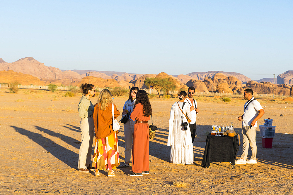 Passengers having a snack and exchanging their impressions after an hot air balloon flight over Hegra site and around with Hero Balloon Flights Saudi Operator, AlUla, Medina Province, Saudi Arabia, Middle East