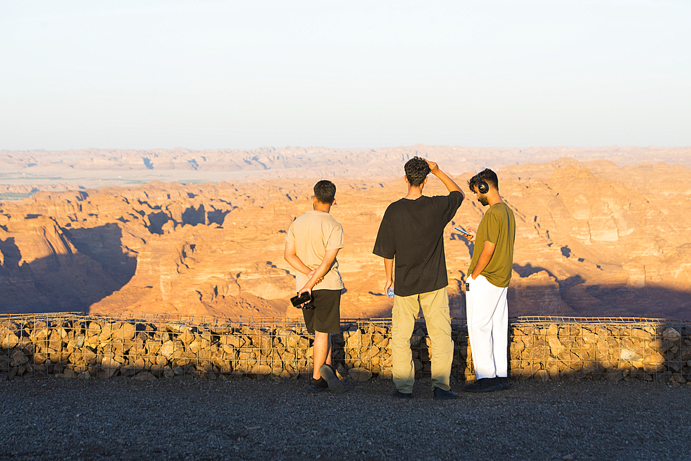 People at the Viewpoint on the Harrat volcanic plateau, AlUla, Medina Province, Saudi Arabia, Middle East