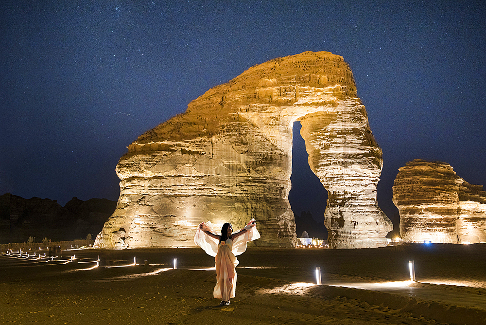 Jabal Alfil by night, also known as Elephant Rock, a natural red sandstone formation in the area of AlUla, Medina Province, Saudi Arabia, Middle East