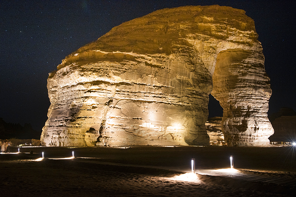 Jabal Alfil by night, also known as Elephant Rock, a natural red sandstone formation in the area of AlUla, Medina Province, Saudi Arabia, Middle East