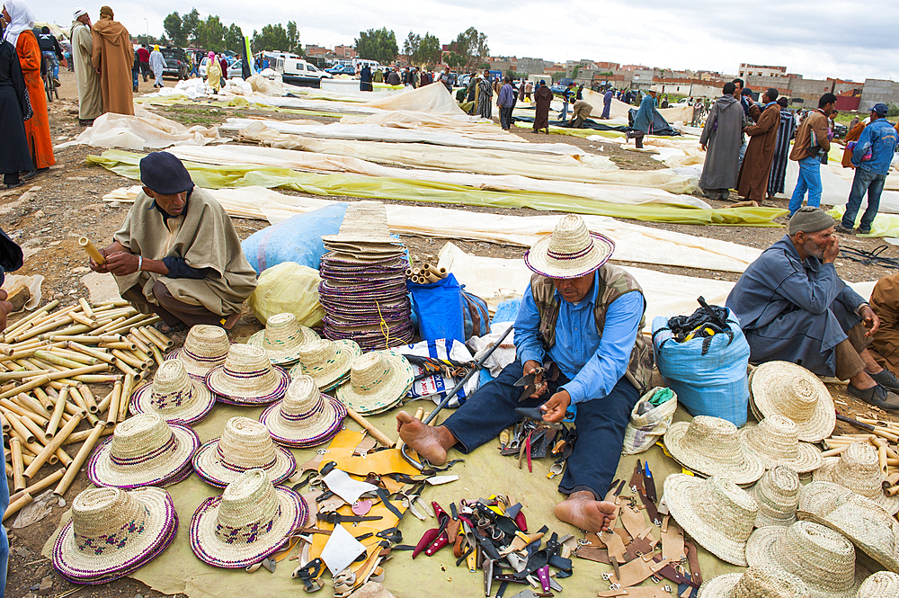 Straw hat seller at the Weekly Berber market,Khenifra province,Middle Atlas,Morocco,North Africa