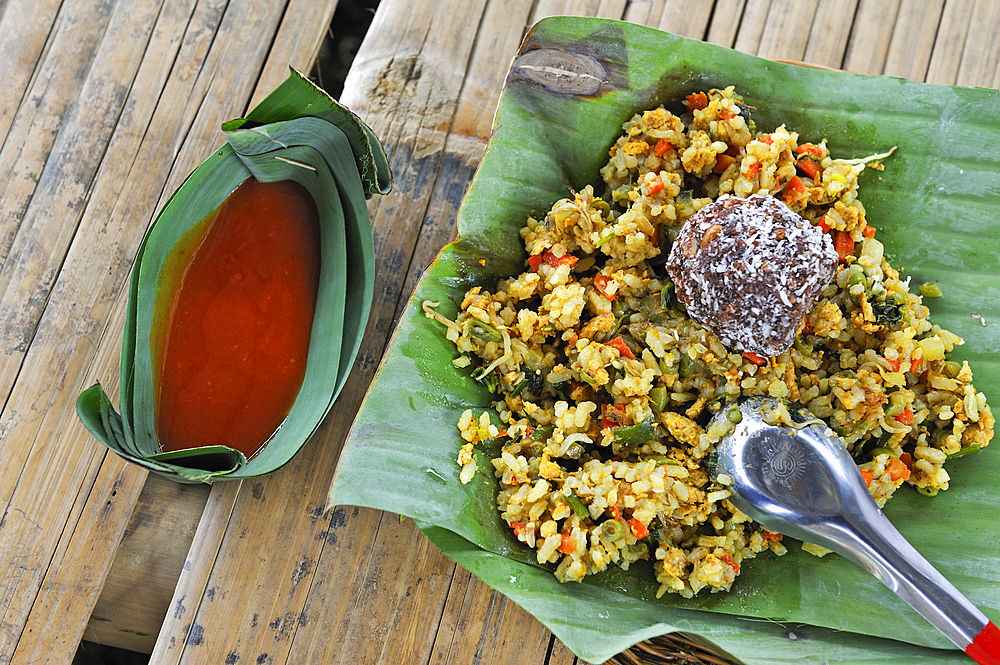 Rice, vegetables and hot sauce served in banana leaves, village of Ban Pha Yong in mountain massif near Nong Khiaw, Luang Prabang Province, Laos, Southeast Asia