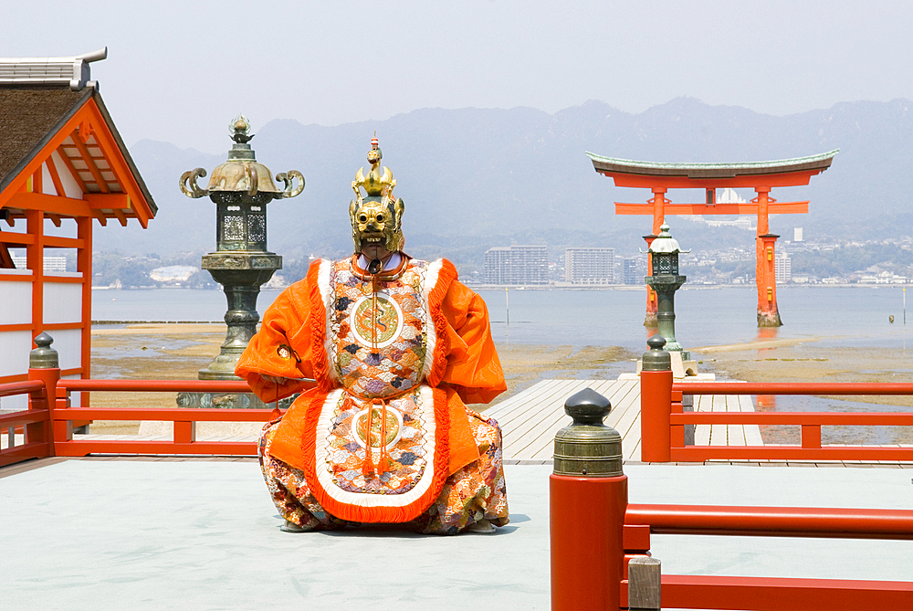 Dance ceremony 'Bugaku' on a stage of the Itsukushima-jinja Shrine on the Miyajima Island, off Hiroshima, Japan