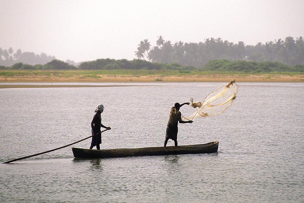 Canoe net fishermen on Mono River mouth in Grand-Popo area, Benin,Gulf of Guinea,West Africa