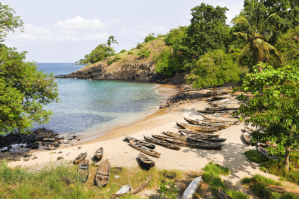 Fisherman's pirogues on a beach of the north coast of Sao Tome Island, Republic of Sao Tome and Principe,Africa