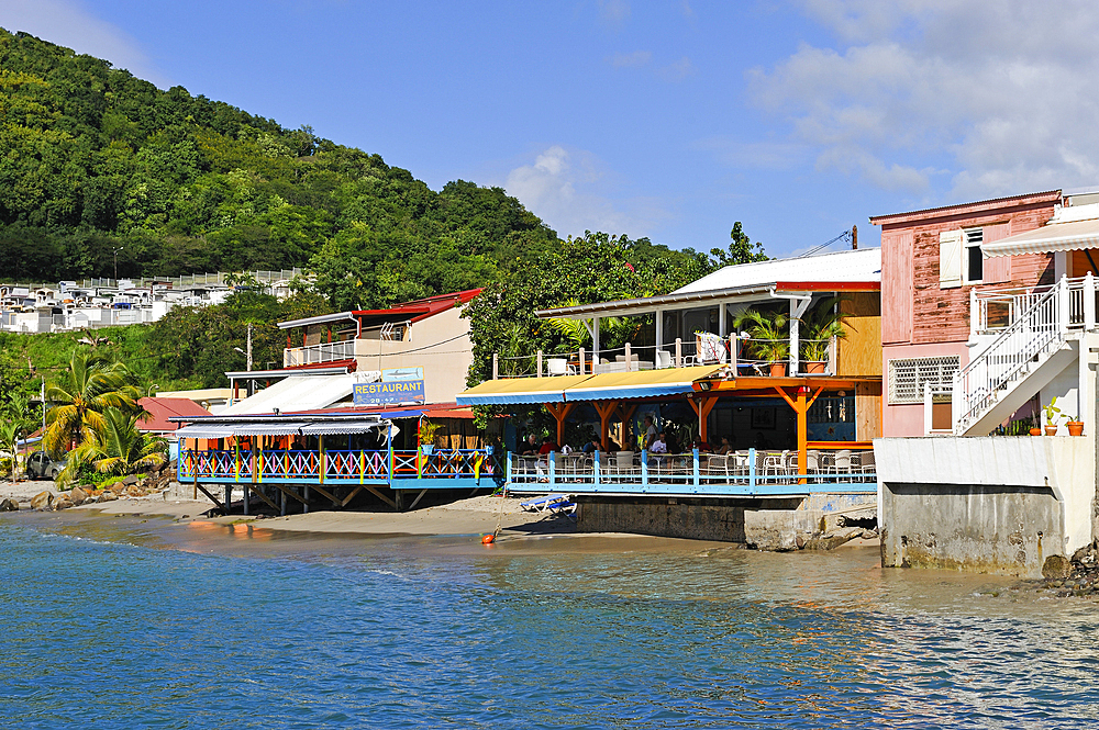 Cafe restaurant terrace on stilts, village of Deshaies, Basse-terre, Guadeloupe, overseas region of France,Leewards Islands, Lesser Antilles, Caribbean
