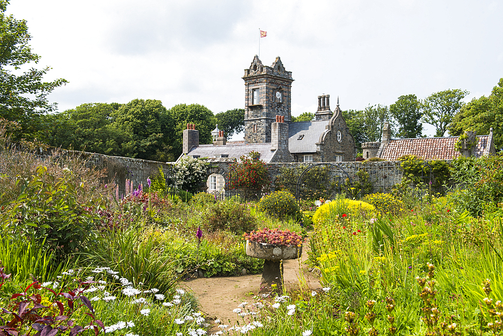 The walled garden with the house in the background, La Seignerie (17th Century), traditional residence of the Seigneur of Sark, Open to the public for the visit of the gardens, Sark island, Channel Islands, Bailiwick of Guernsey, United Kingdom