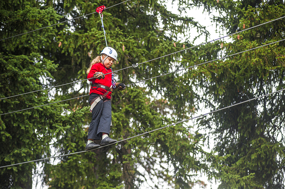 Young girl on a rope bridge at La Rosiere, ski resort in the territory of the commune of Montvalezan, Savoie department, Rhone-Alpes region, France, Europe