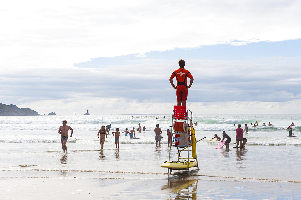 Swimmers and surf-riders are protected by a team rescue of the SNSM French organisation,beach of the Baie des Trepasses or Bay of Dead located between the Pointe du Raz and the Pointe du Van,Cap Sizun,Finistere department,Brittany region,west of France,we