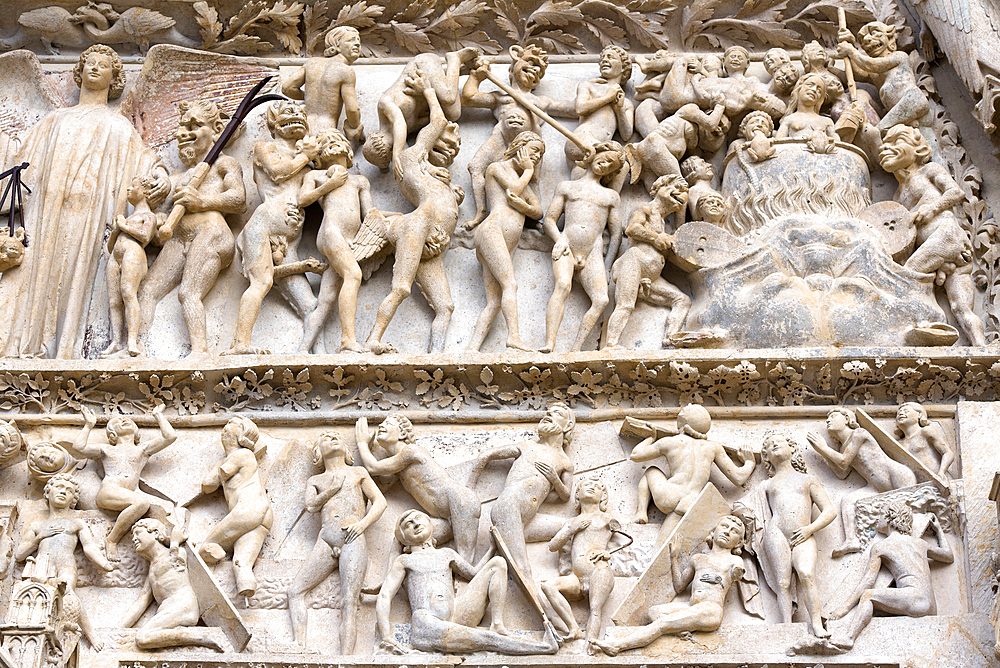 The punishment of sinners depicted on the Tympanum over the Central portal of the west facade, Saint Stephen Cathedral, Bourges, Cher department, Province of Berry, Centre-Val de Loire region, France