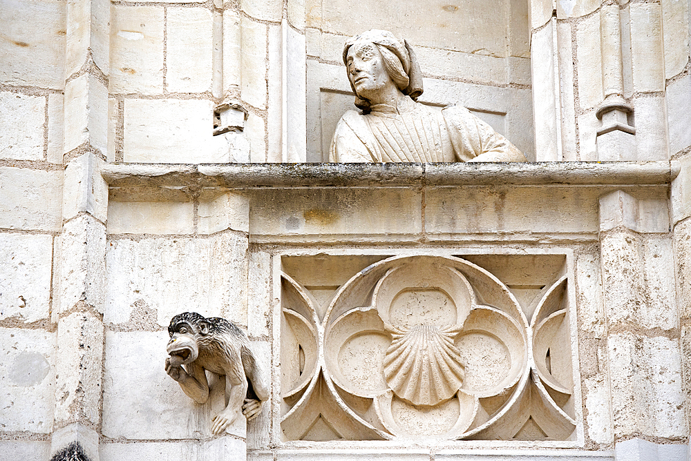 Statue (probably Jacques Coeur) on the balcony of a false window of the exterior facade of the Jacques Coeur's palace, Bourges, Cher department, Province of Berry, Centre-Val de Loire region, France