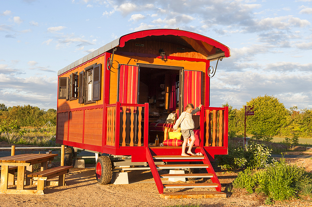 Young girl in a trailer, The Roulottes du Berry,Pole du Cheval et de l'Ane (Horse and Donkey Center),Ligneres,Cher department,Berry province,region of Centre,France,Europe