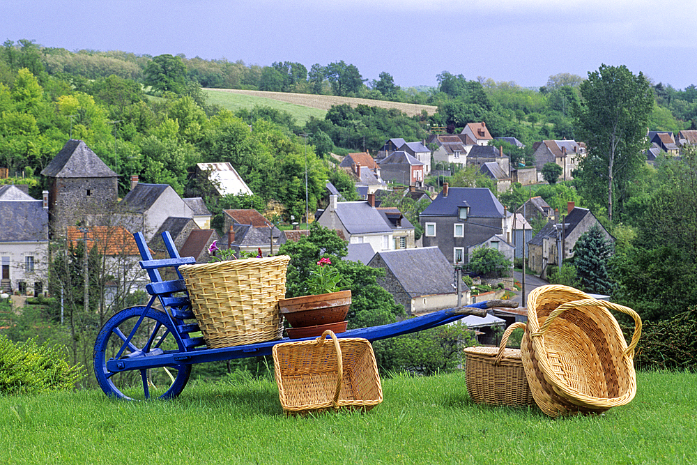 Wicker basket display with the village of Villaines-les-Rochers in the background, Indre-et-Loire department, Centre region, France, Europe