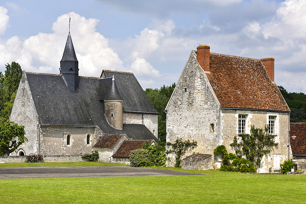 Church of Notre-Dame and house of Ferriere-sur-Beaulieu at the edge of the national Forest of Loches in Touraine, department of Indre-et-Loire, Centre-Val de Loire region, France, Europe