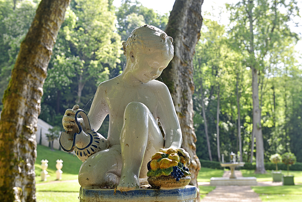 Young girl statue with jug and basket of fruit in the gardens of the Royal Domain of Chateau-Gaillard at Amboise, Touraine, department of Indre-et-Loire, Centre-Val de Loire region, France, Europe