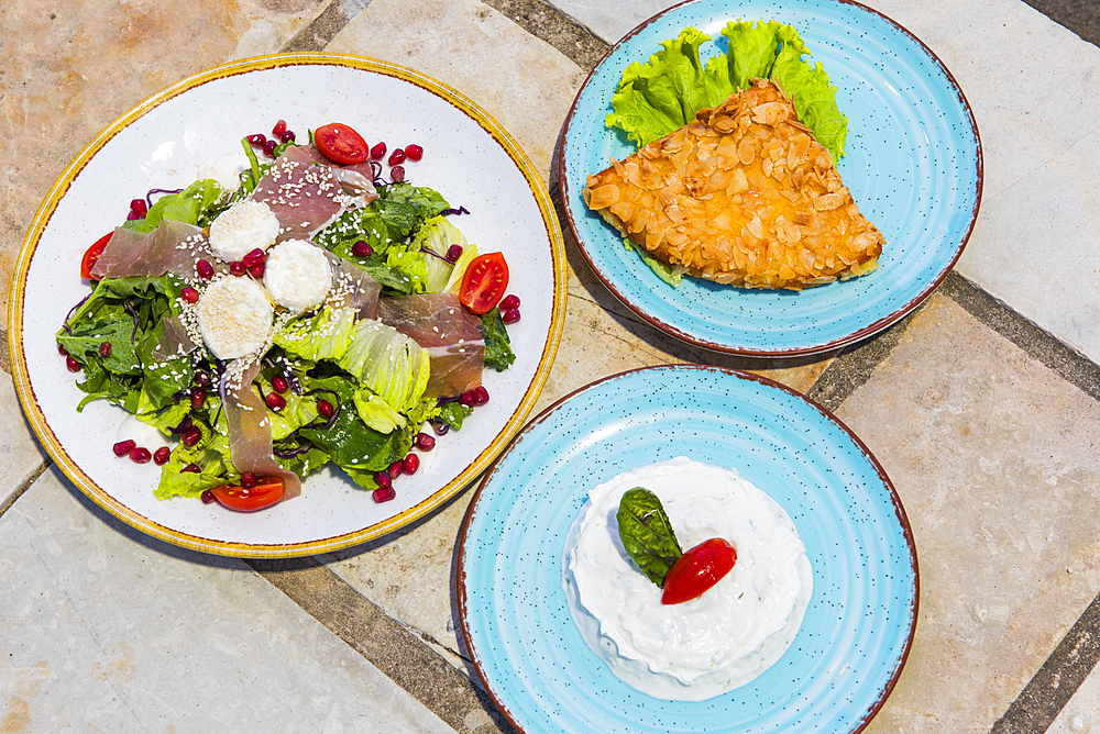 Dishes served at the Castle restaurant, located in an old fortress (Lekursi) overlooking the bay of Saranda, Albania, Europe