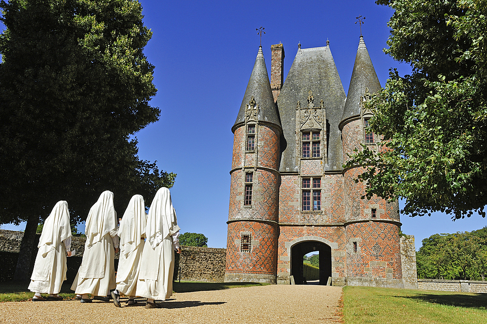 Nuns at the entrance of the Chateau de Carrouges, Domfront, department of Orne, Normandie region, France, Europe