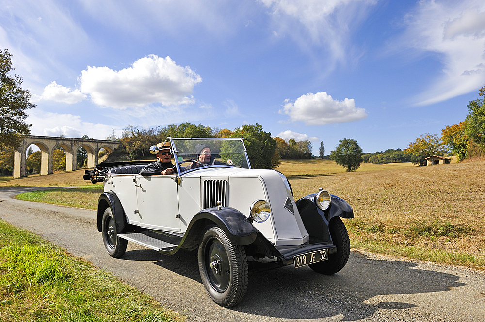 Drive with an open touring vintage car (Renault 1925) around Auch.Gers department, Occitanie region, southwest of France,Europe