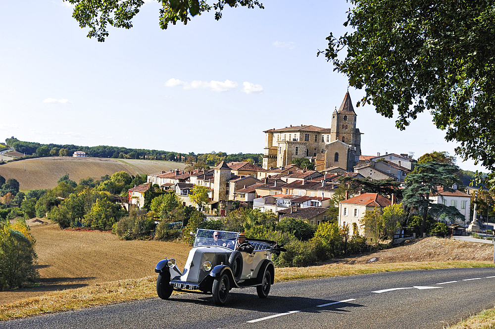 Drive with an open touring vintage car (Renault of 1925) around Lavardens,Gers department, Occitanie region, southwest of France,Europe